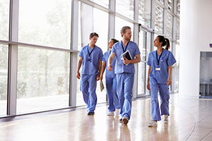 Image of Florida Healthcare Industry Workers Walking in Scrubs